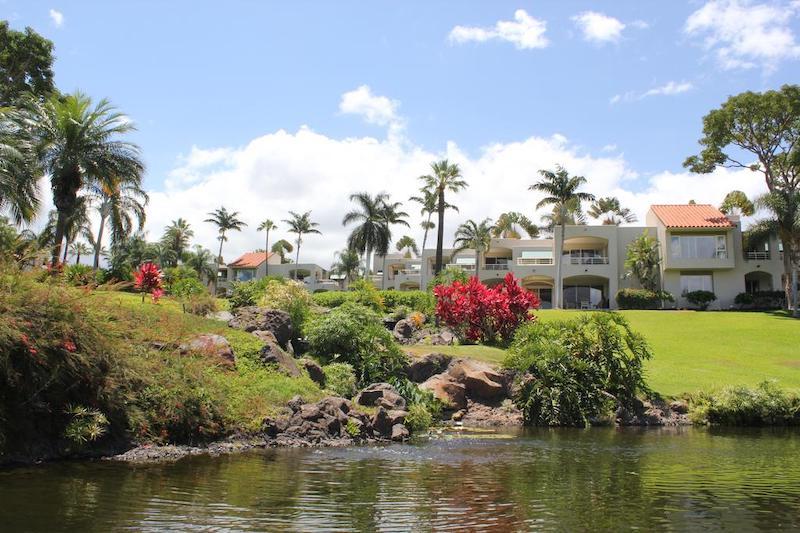 A creek runs down through the center of the Palms at Wailea property to a lagoon area